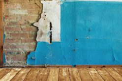 Abandoned Room with Old Painted Brick Wall