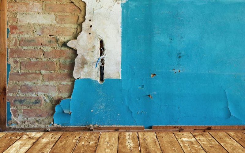 Abandoned Room with Old Painted Brick Wall
