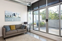 Living Room With Sliding Glass Door to Balcony