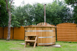 Rustic Wooden Water Hot Tub Tucked in Backyard