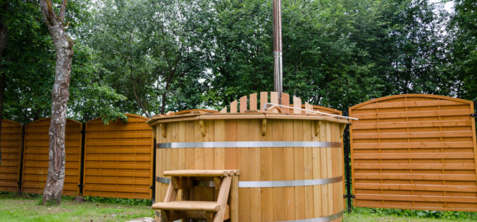 Rustic Wooden Water Hot Tub Tucked in Backyard
