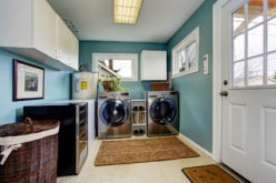 Light Blue Laundry Room With Modern Laundry Appliances