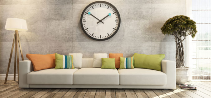 Modern Sofa Underneath Big Wall Clock