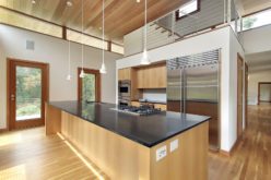 Kitchen in Ultra Modern Home with Sleek Granite Island