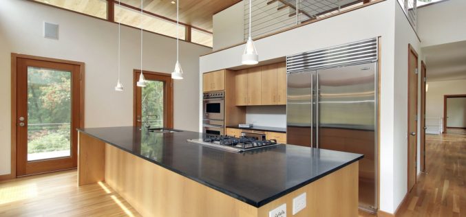Kitchen in Ultra Modern Home with Sleek Granite Island