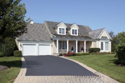 Home With a Partial Brick and Asphalt Driveway