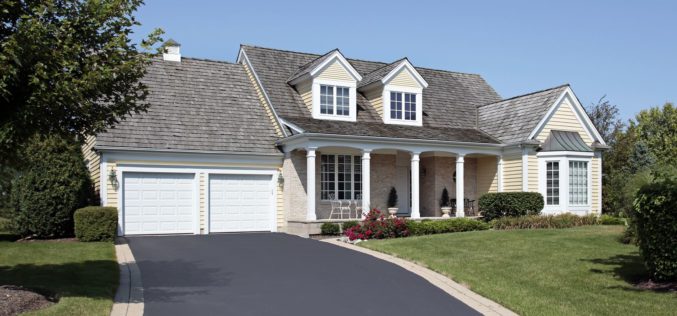Home With a Partial Brick and Asphalt Driveway
