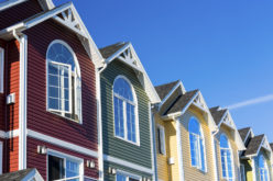 Row of Colorful Townhouses with Varied Colored Vinyl Siding