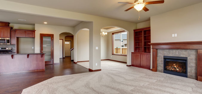 Unfurnished Living Room with Part Carpet and Wood Flooring
