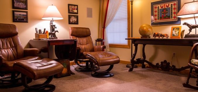 Enjoying a Home Video in Comfortable Home Theater Seating