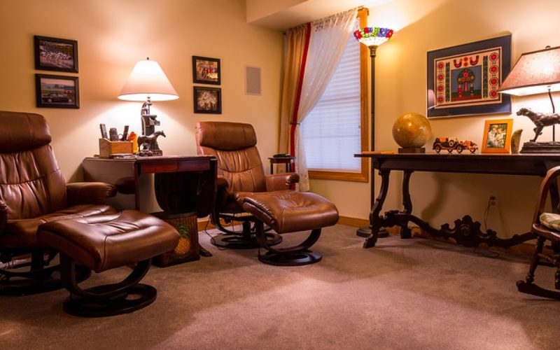 Enjoying a Home Video in Comfortable Home Theater Seating