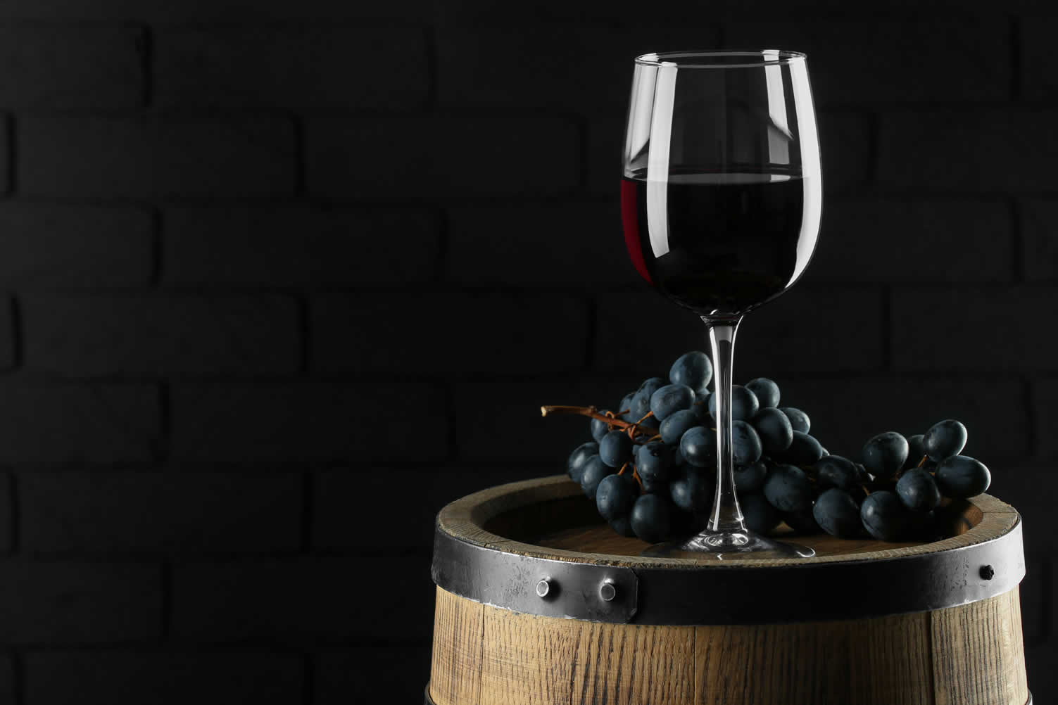 growing grapes in wine barrels